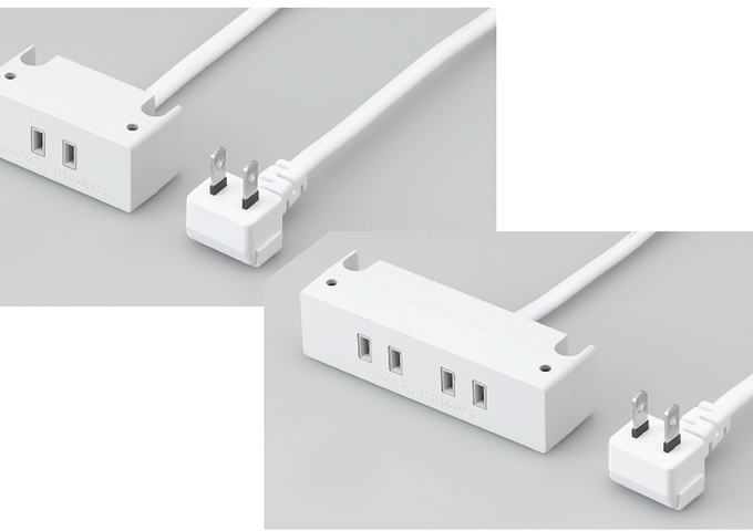 手袋をした手が電子基板を扱う写真